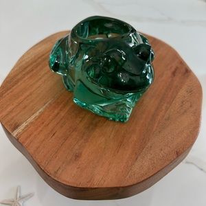 A Pair of heavy glass candle volives one is a frog , the other a turtle.